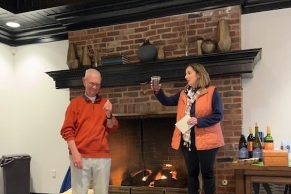Kyle Demeter toasts Howard Hanson for his many years of service at the Warren Golf Course