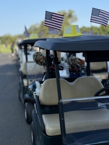 Bone Frog Open - Irish Edition Golf Carts staged and decorated with American flags